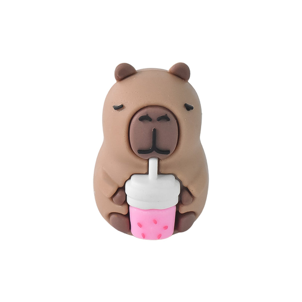 A single capybara-shaped pencil sharpener, brown with a pink drink, on a white background.