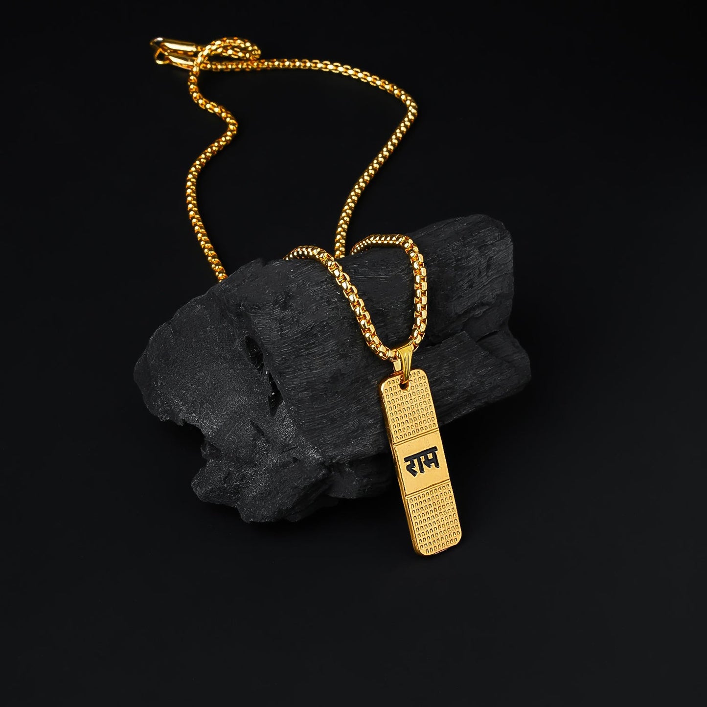 Gold plated Ram Naam locket with chain on a white background, showcasing its elegant design.
