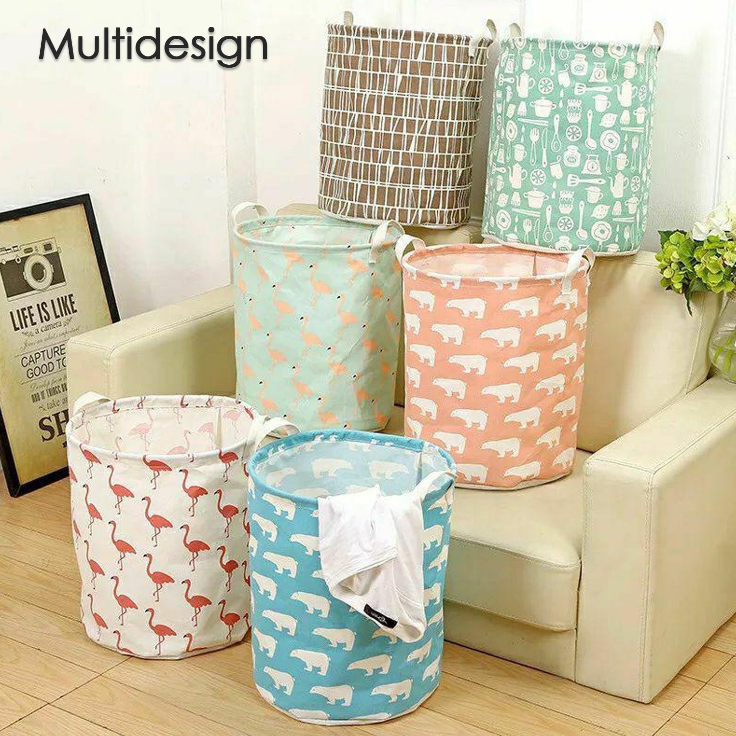 Six fabric laundry hampers with various patterns including flamingos, polar bears, and kitchen utensils, arranged on and