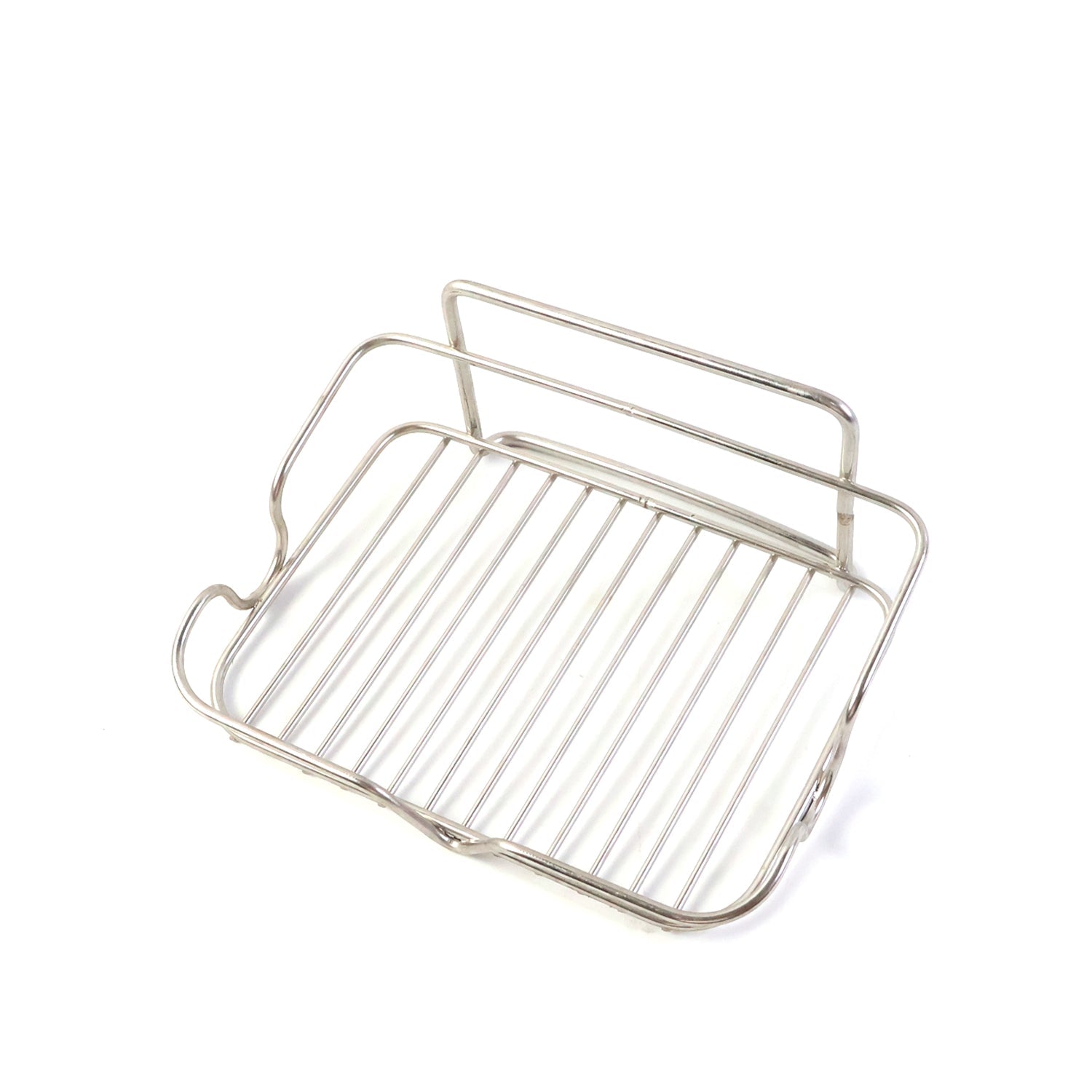 Elevated stainless steel soap stand holding bathroom essentials securely