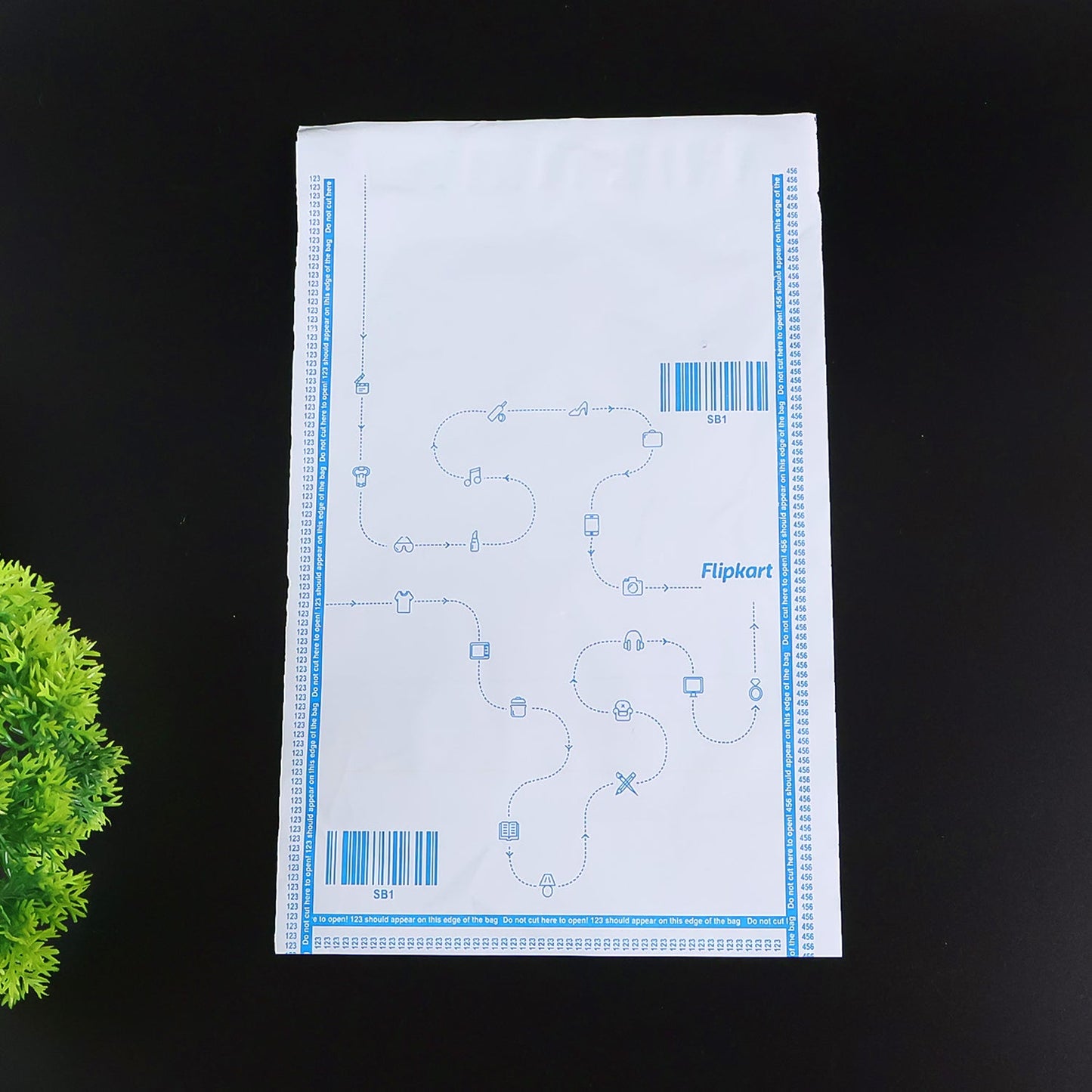 Stacked Flipkart branded security courier bags for packaging