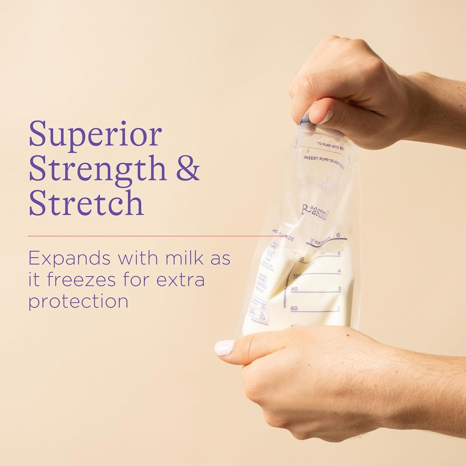Hands stretch a breastmilk storage bag filled with milk, illustrating its strength and stretch.
