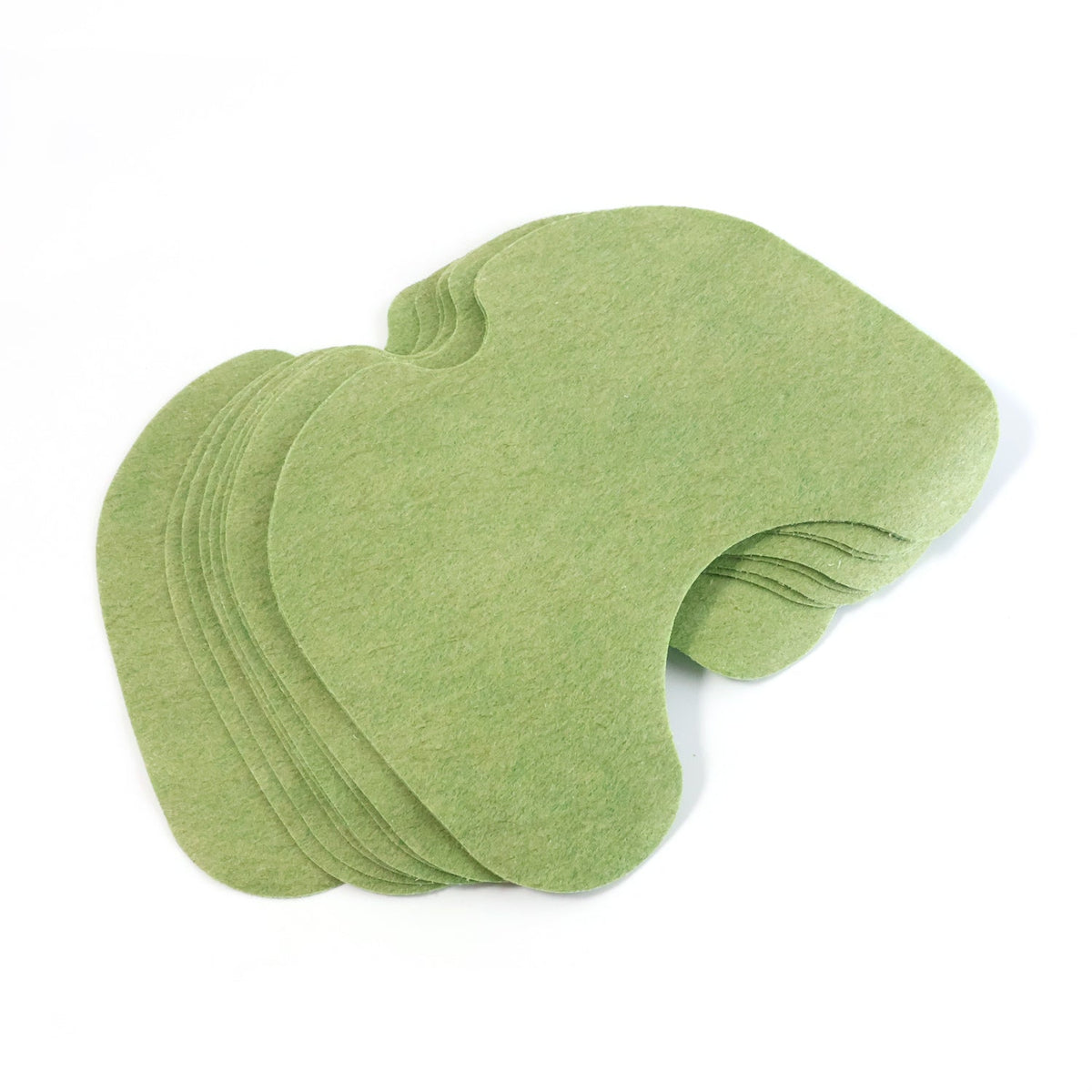 A stack of green, contoured knee relief patches is shown from an elevated perspective on a white background.