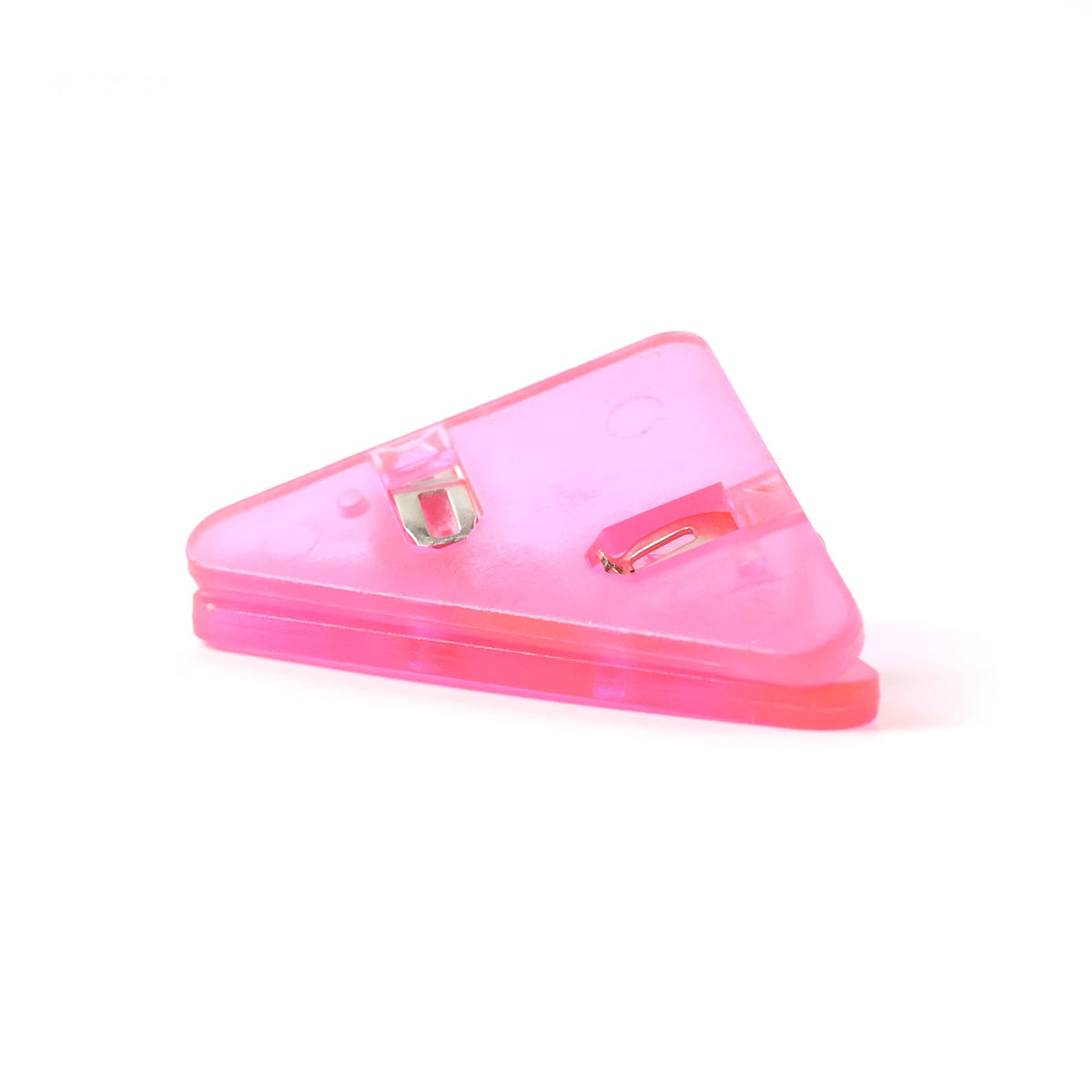 A single pink plastic triangle corner clip on a plain white background.