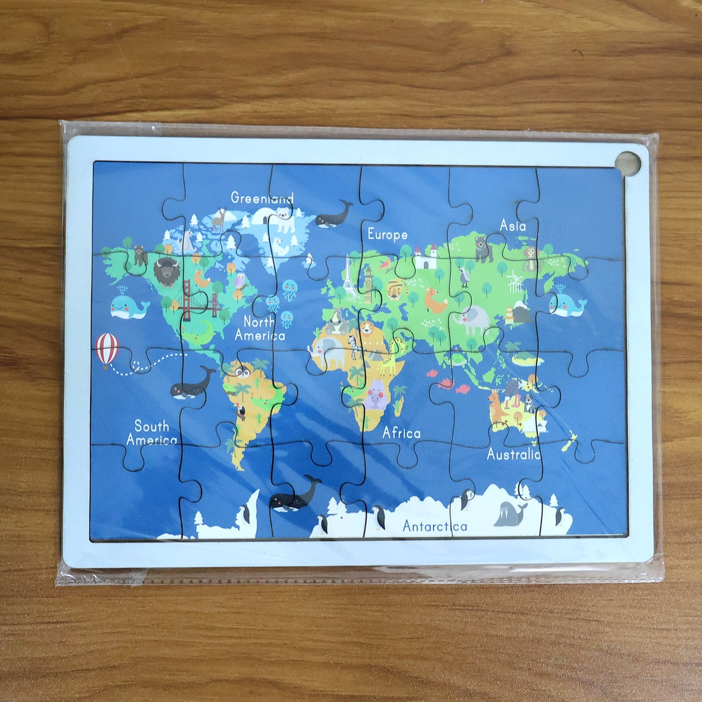 Interactive wooden world map puzzle for kids, promoting hands-on learning.