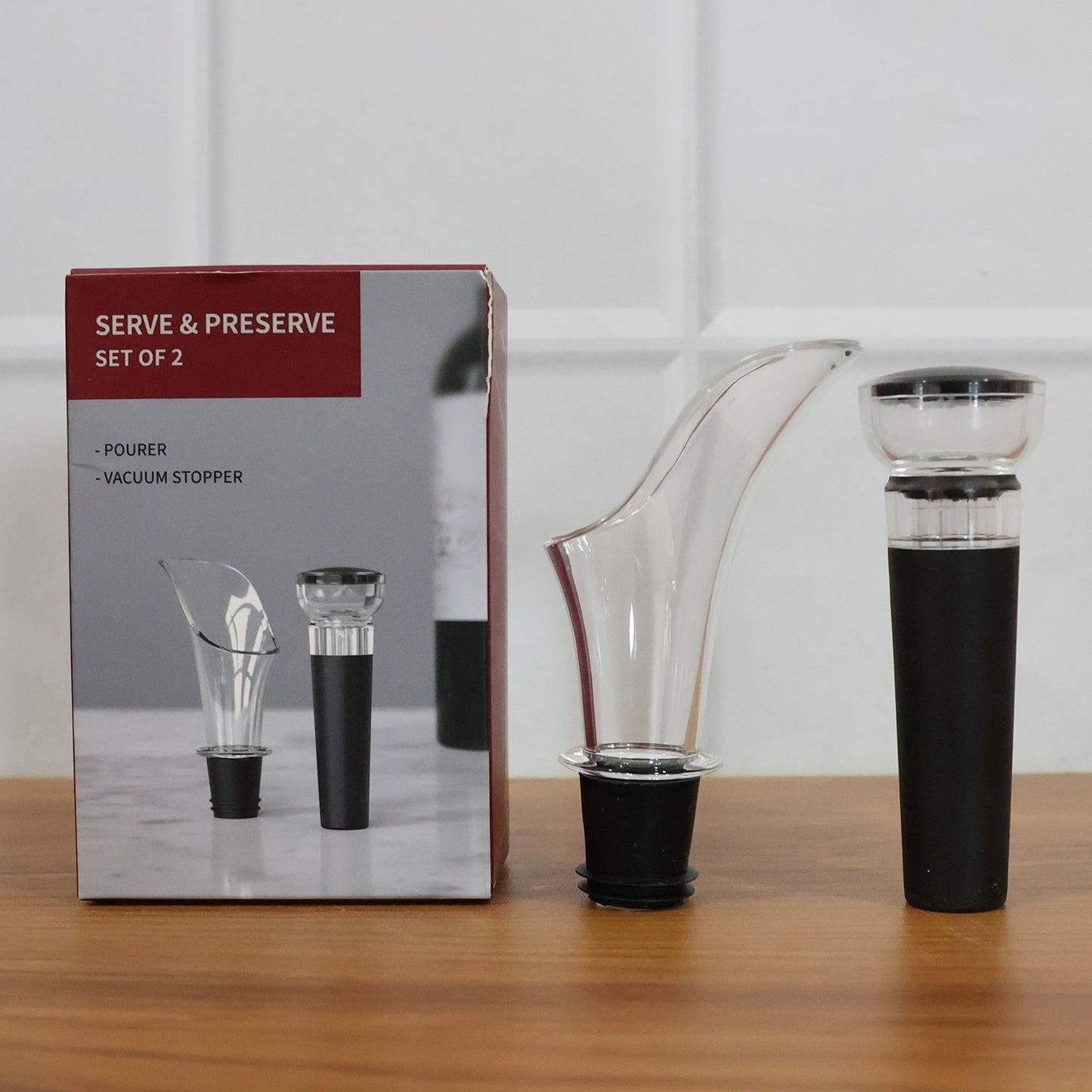 Set of wine pourer and vacuum stopper accessories for wine lovers