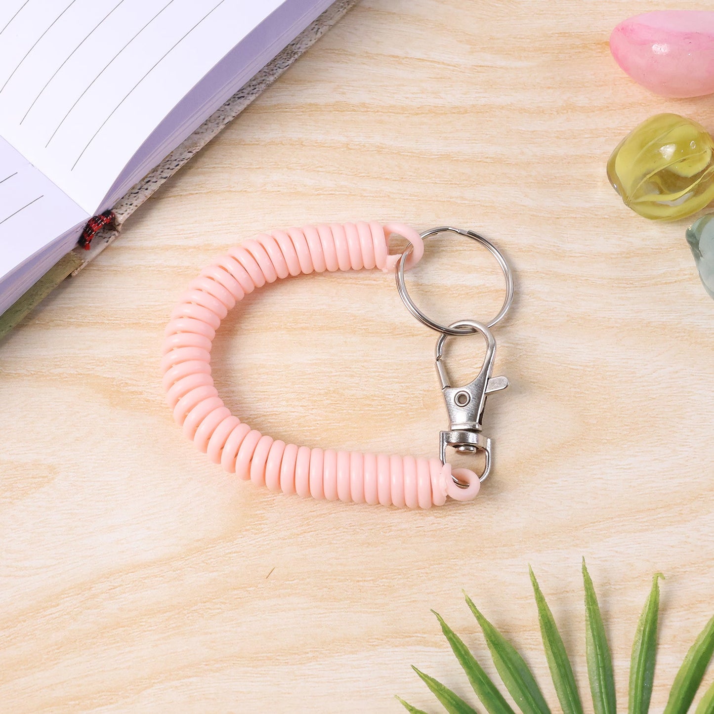 Key holder wristband featuring durable metal key ring attachment