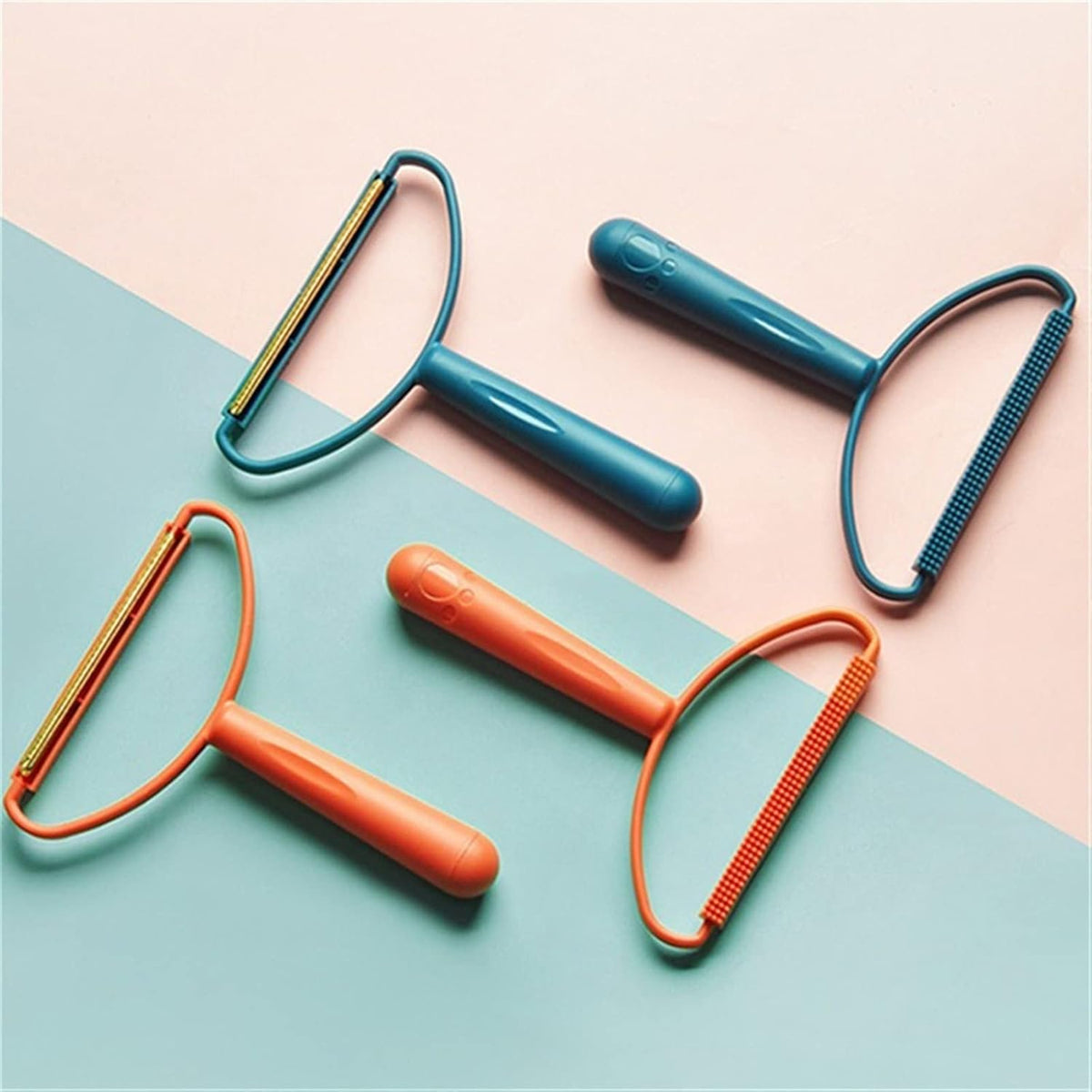 Two orange and two blue lint removers with both fabric brush and metal shaver sides, on a pink and blue background.