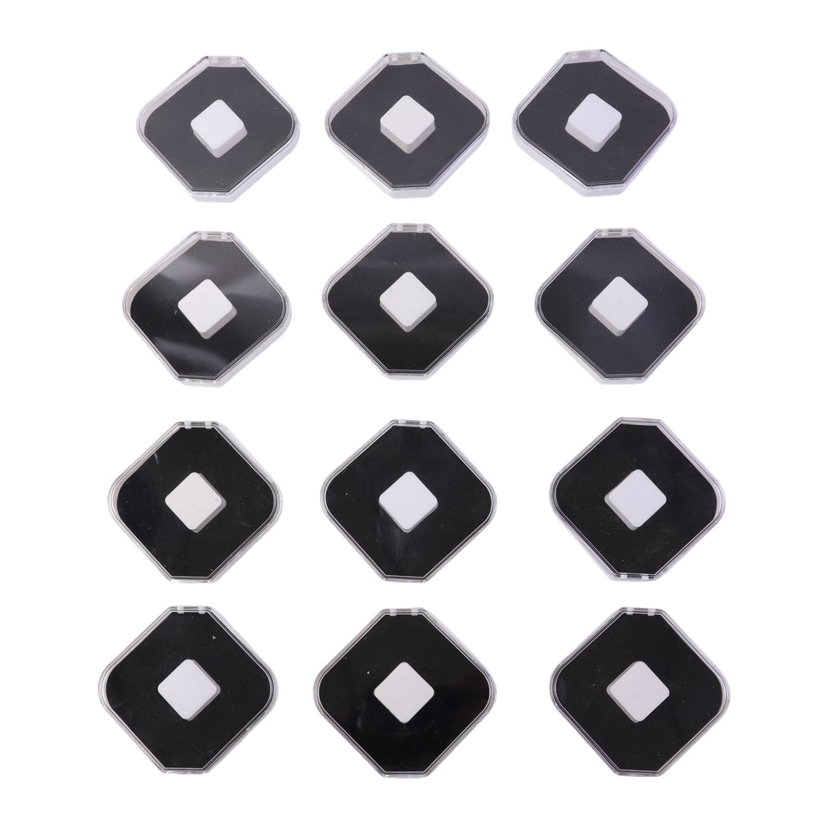 Twelve clear and black jewellery boxes with white cushions, arranged in a grid on a white background.
