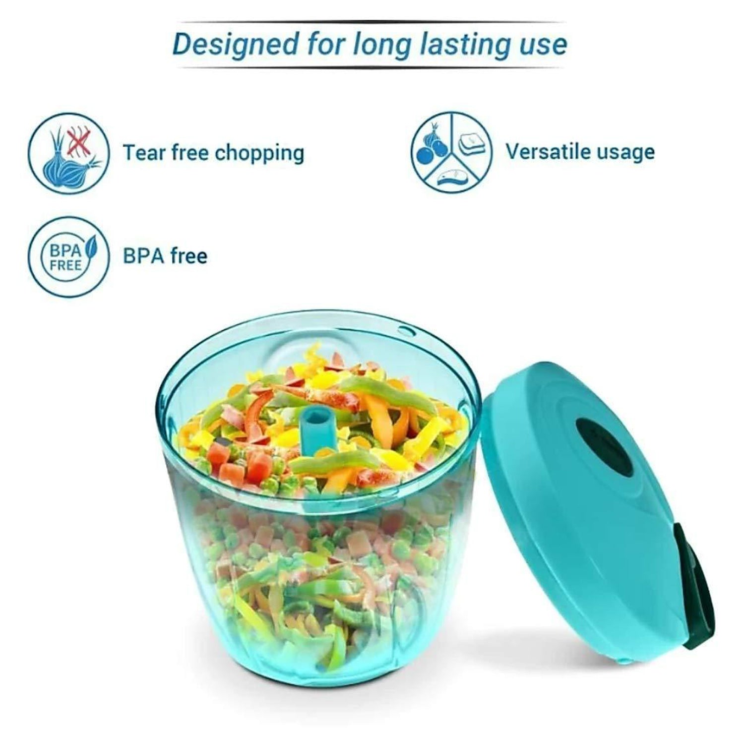 An open teal manual food chopper filled with colorful diced vegetables, with its lid resting beside it.