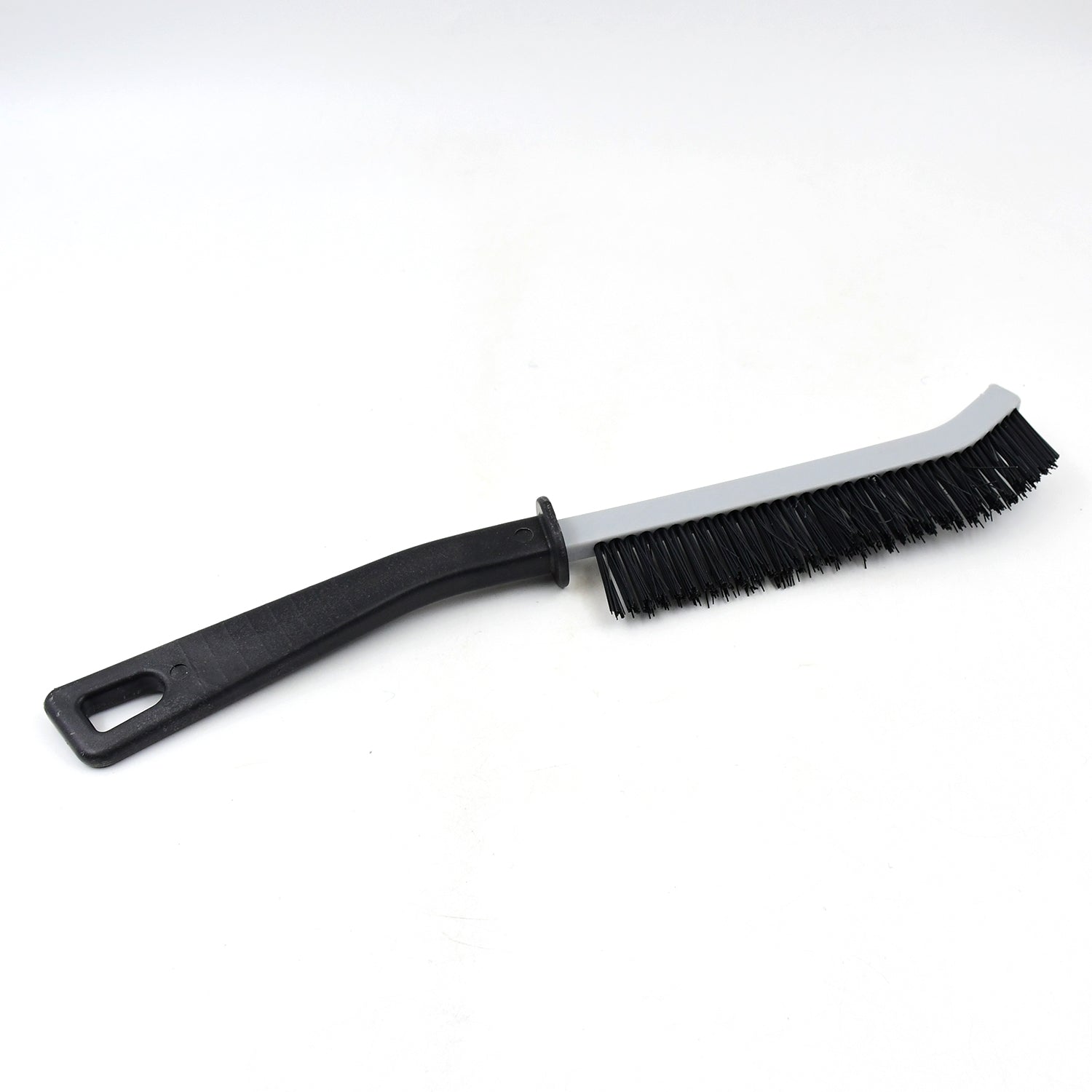 A black and gray crevice cleaning brush with black bristles is shown on a plain white background.