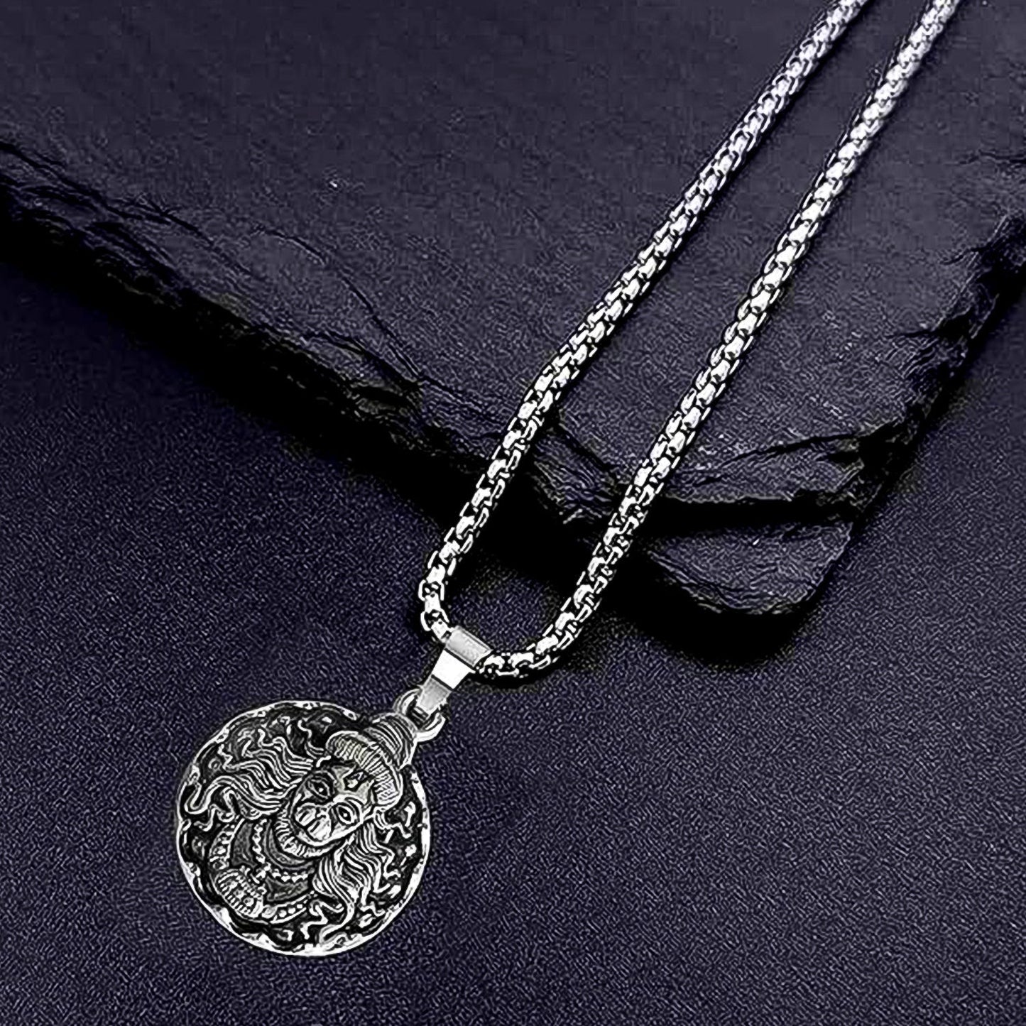 Close-up of the handcrafted Hanuman Locket with silver chain, showcasing intricate details.