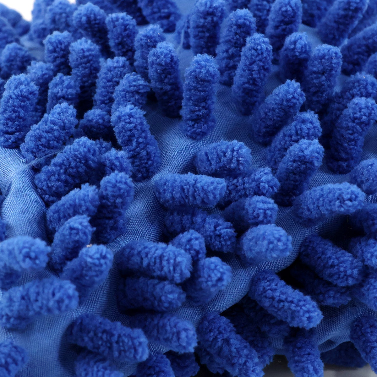 A close-up view of the blue, shaggy microfiber material of the wash mitt.