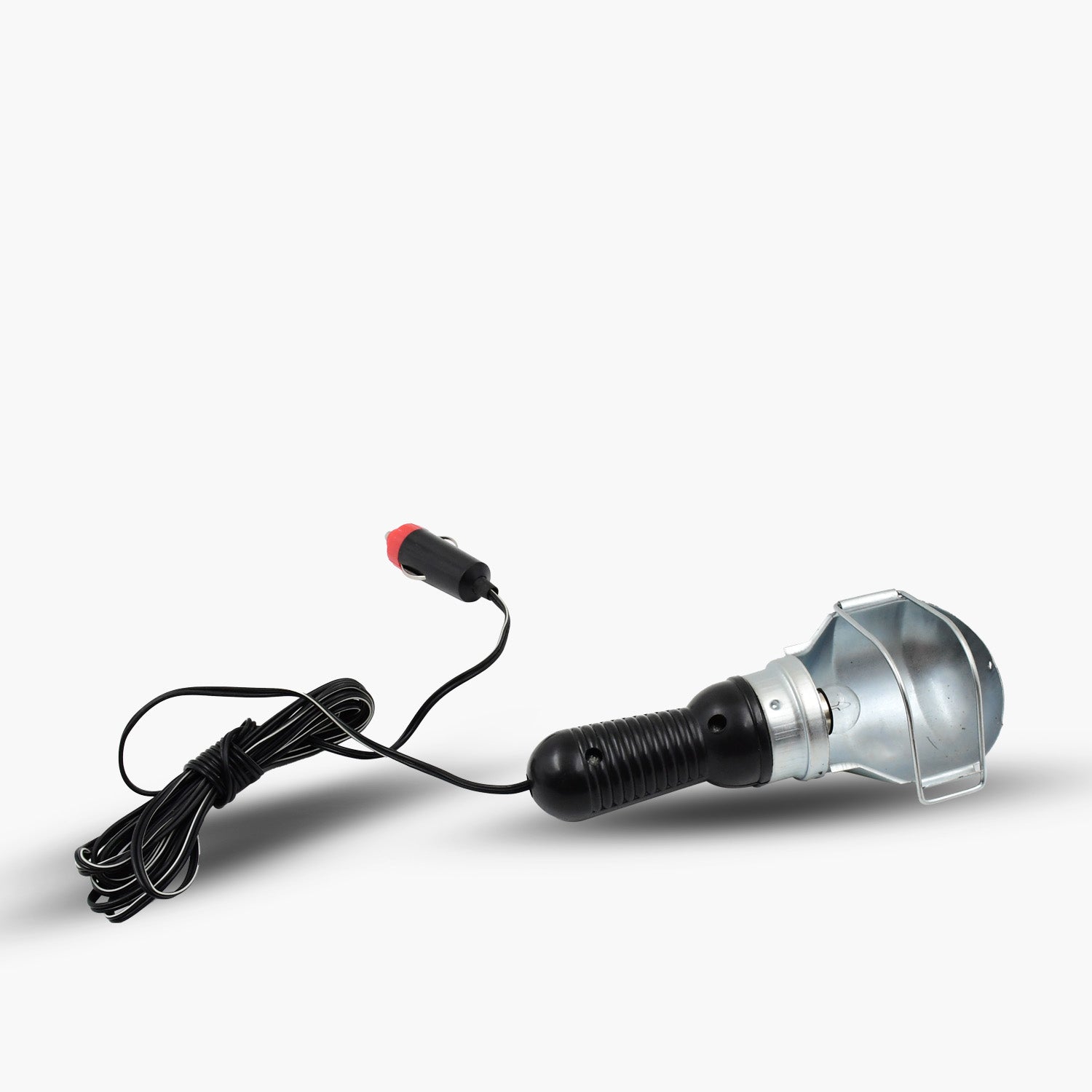 Portable construction lamp providing bright light in a dark workshop.