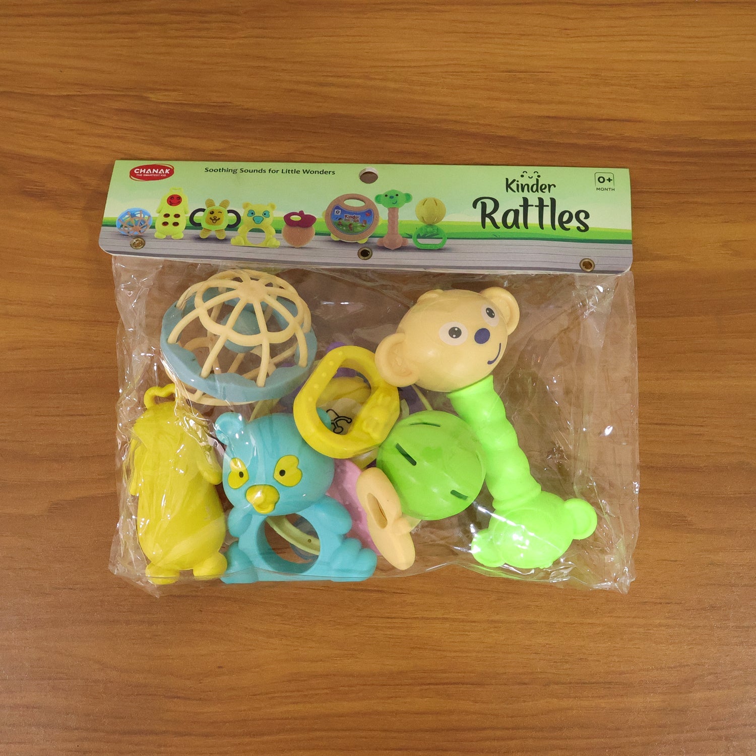 Overhead view of a neatly arranged collection of engaging baby rattles.