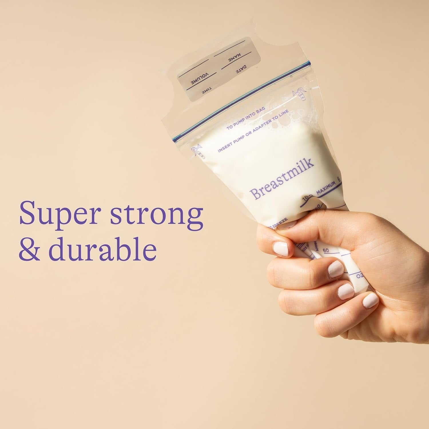 A hand squeezes a breastmilk storage bag filled with milk, demonstrating its super strong and durable material.