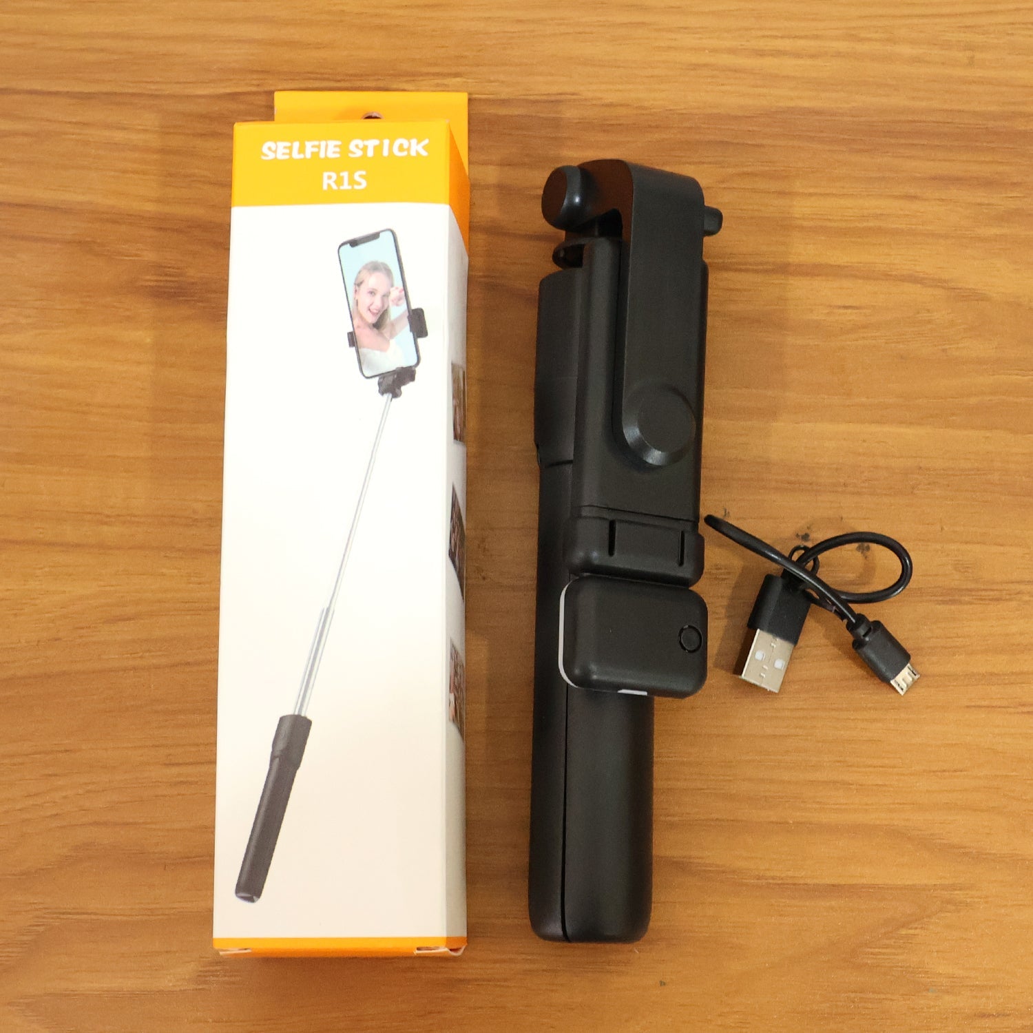 Versatile wired selfie stick with tripod stand and built-in light features