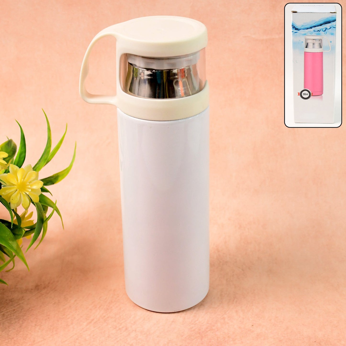 Glossy stainless steel water vacuum bottle placed on wooden surface