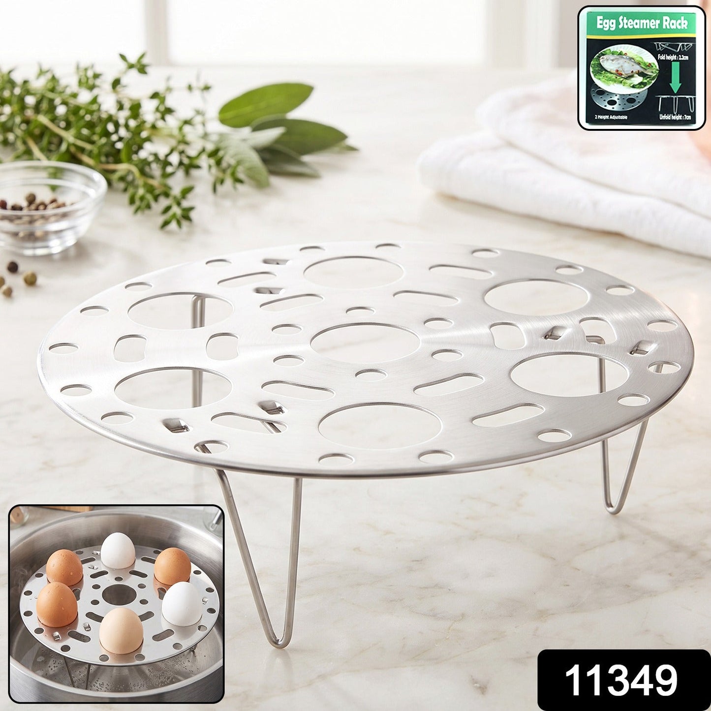 A stainless steel egg steamer rack with folding legs on a white marble counter, with herbs in the background. A small inset