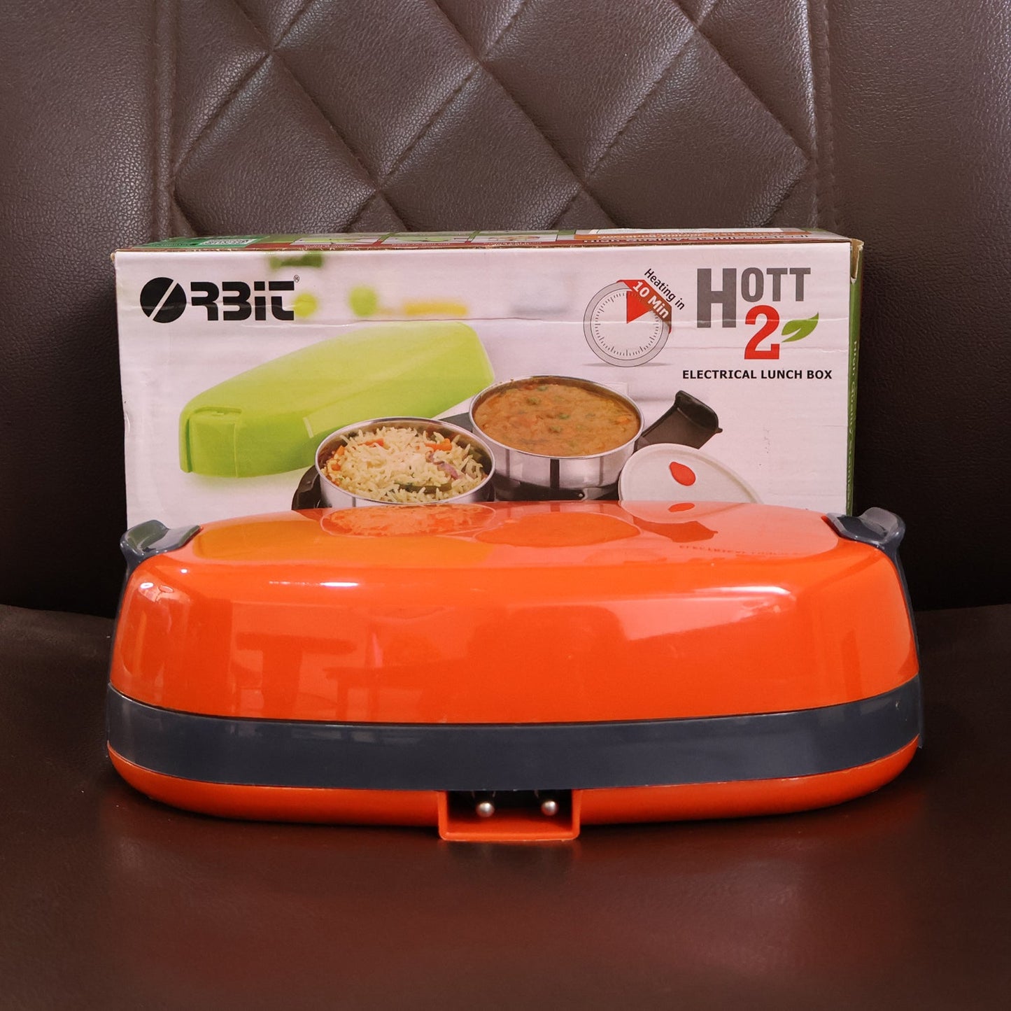 Electric lunch box with food inside ready to be heated