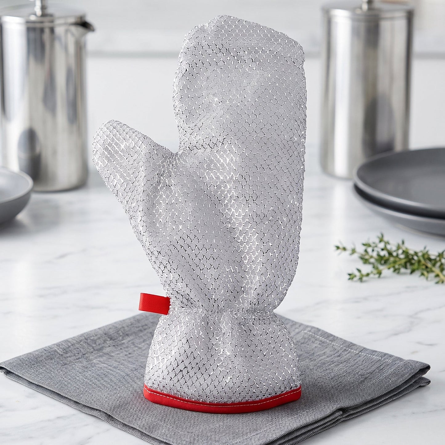 Reusable kitchen glove displayed on a countertop