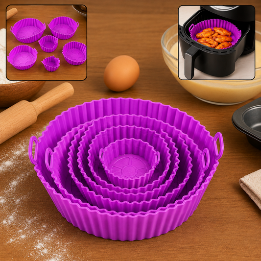 A set of purple silicone air fryer pots with handles, an egg, and a bowl of batter on a wooden surface.
