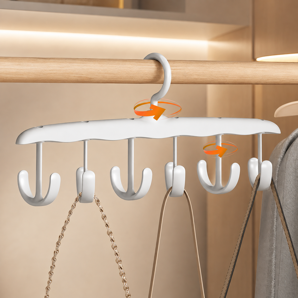 White plastic hanger with six rotating hooks, holding two bags on a wooden closet rod.