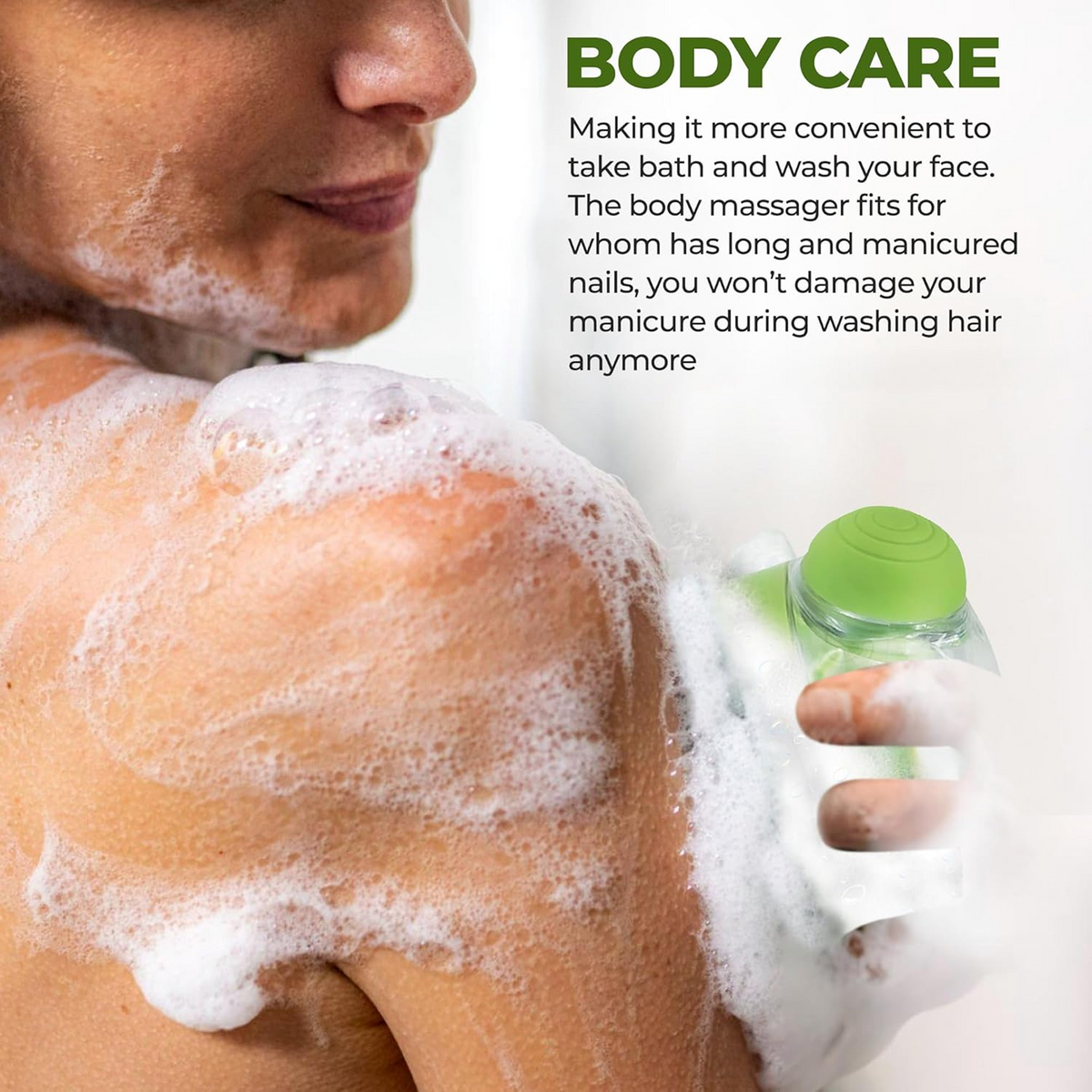 A person's shoulder and chest are covered in soap suds, with a green silicone bath brush visible in their hand.
