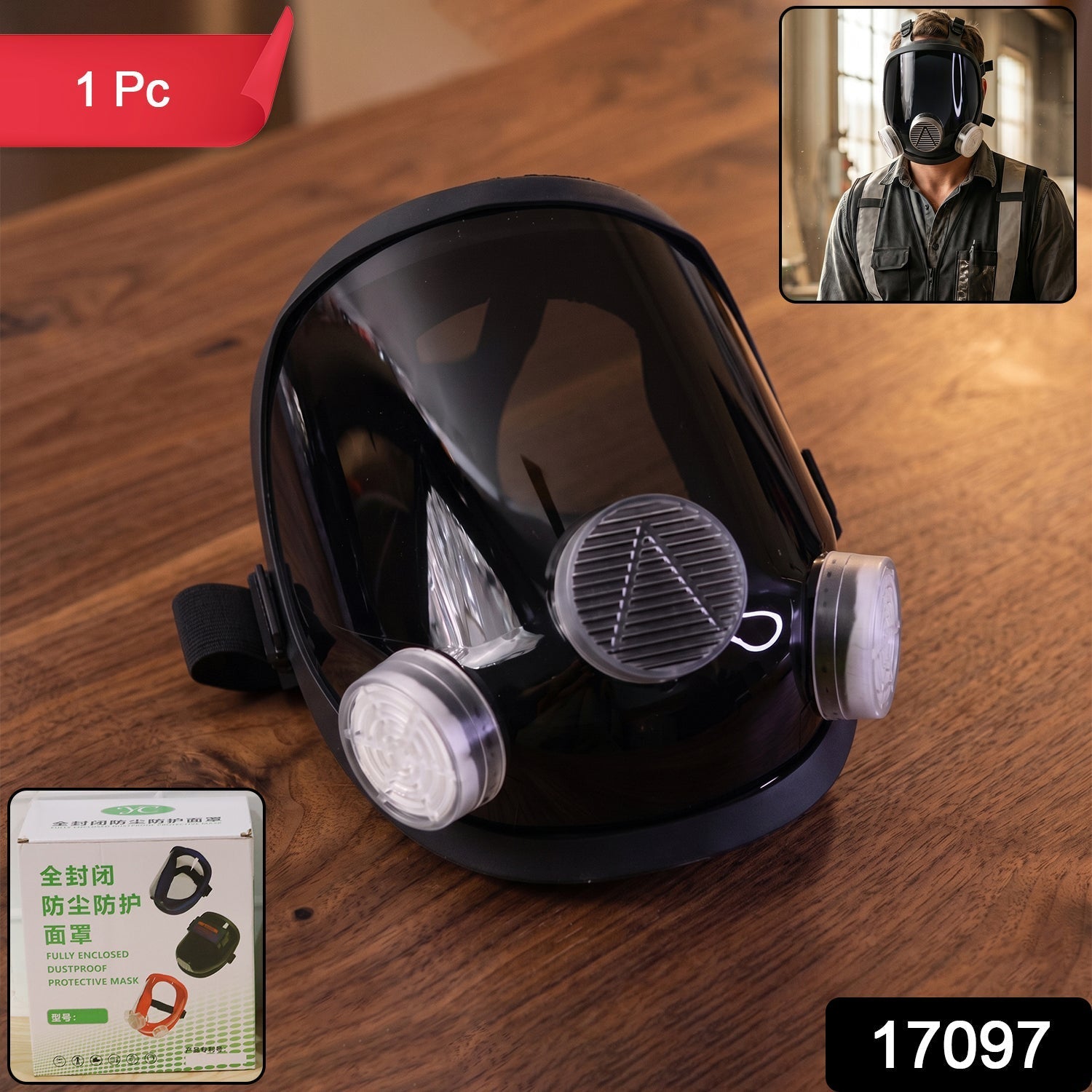 Black full face respirator mask with clear visor and two white filters on a wooden surface