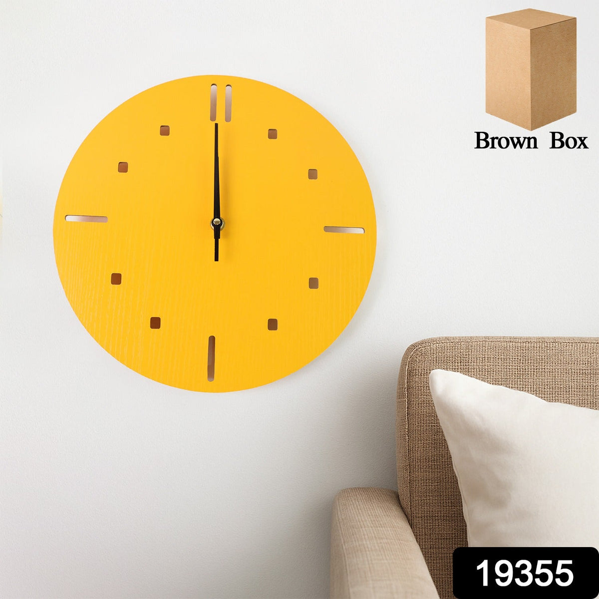 A yellow round wall clock with recessed hour markers and black hands hangs above a light brown sofa with a white pillow. A
