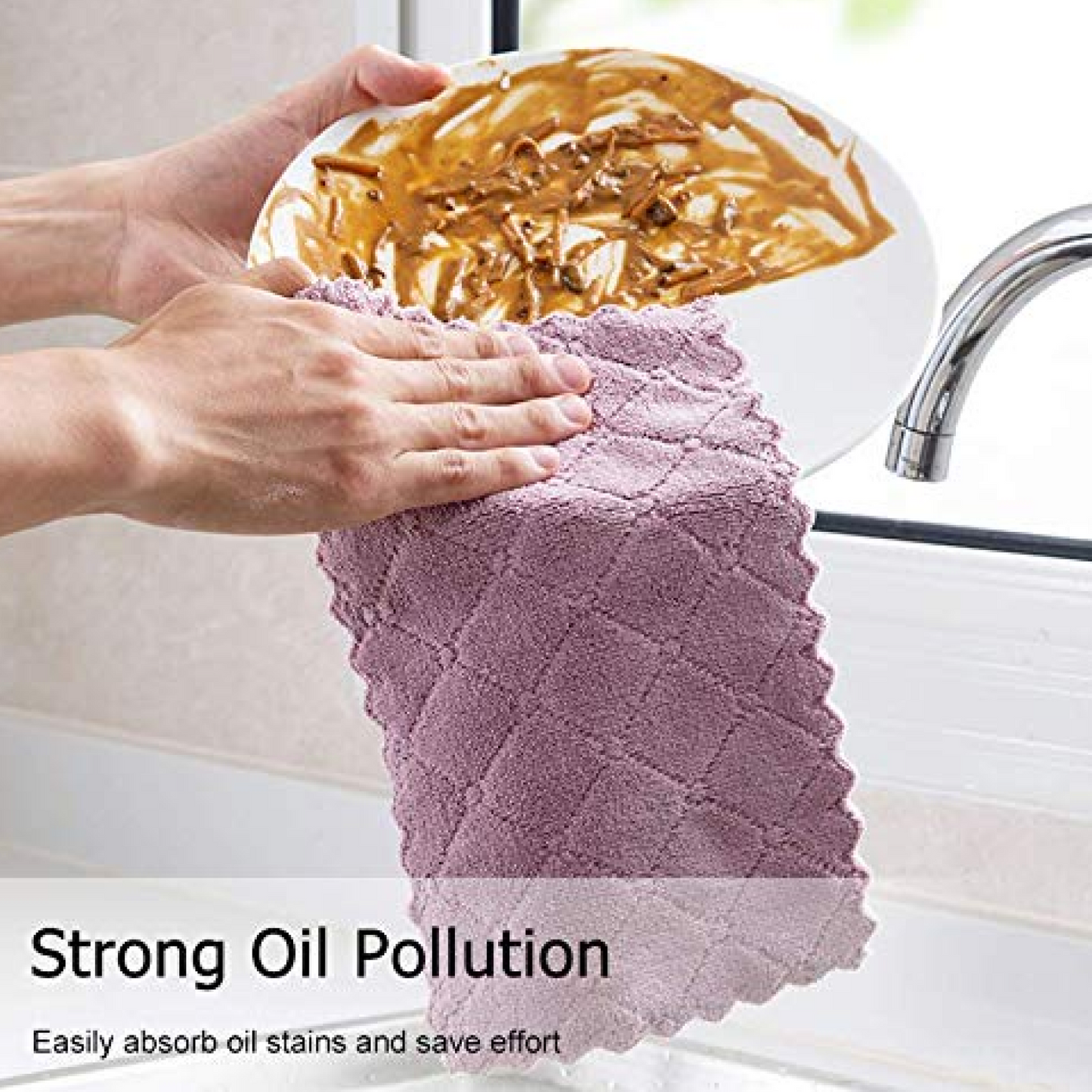 A hand uses a purple microfiber towel with a textured pattern to wipe a white plate covered in food residue.