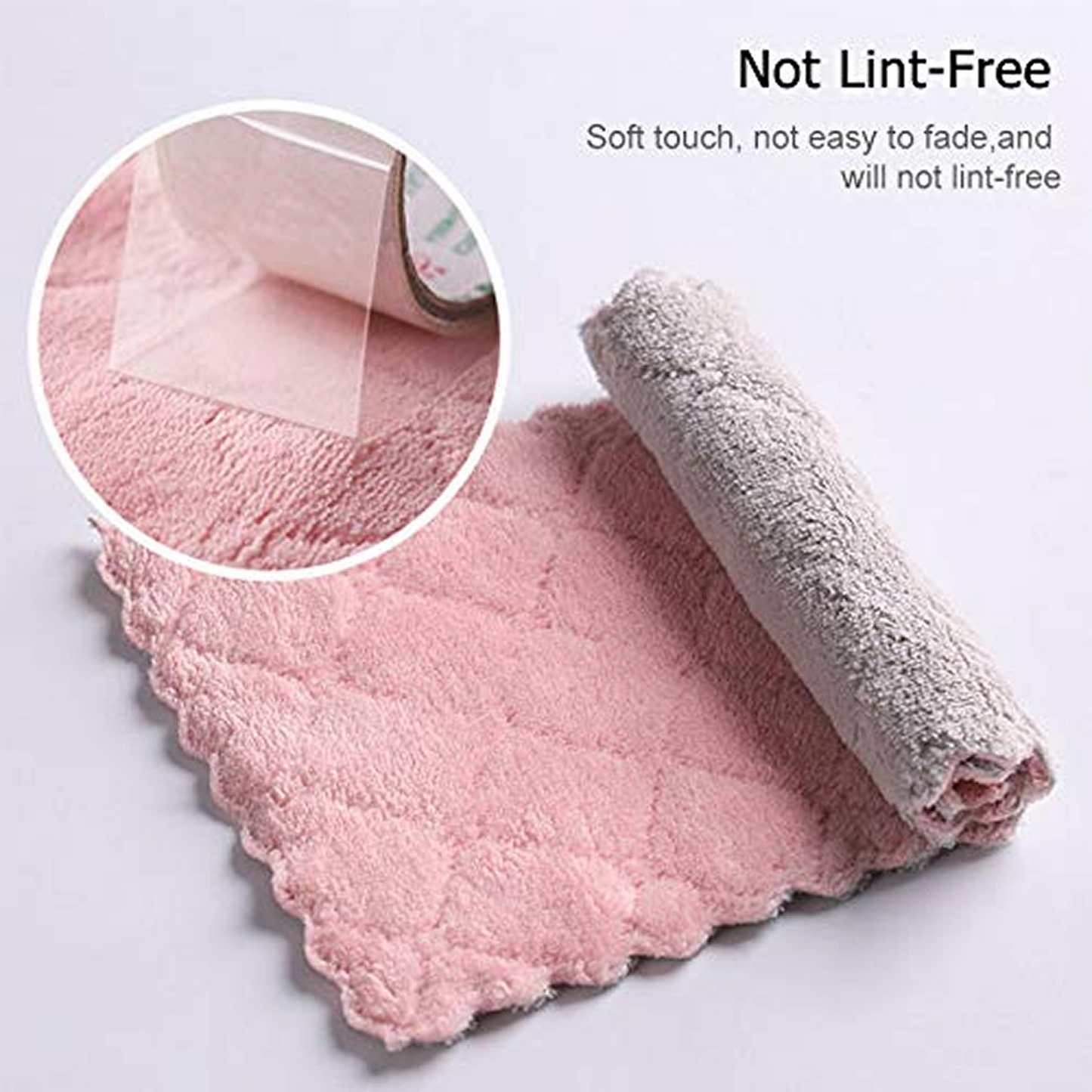 A pink and gray dual-sided microfiber towel is shown flat with a rolled-up section, highlighting its soft texture.
