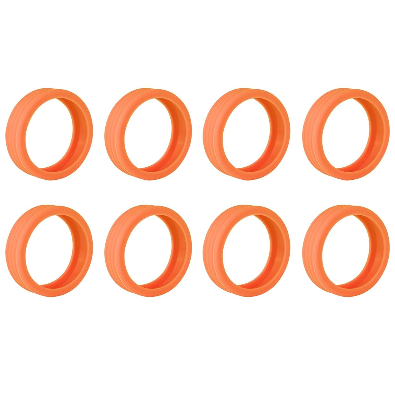 Eight orange silicone wheel covers with a ribbed texture, arranged in two rows on a white background.