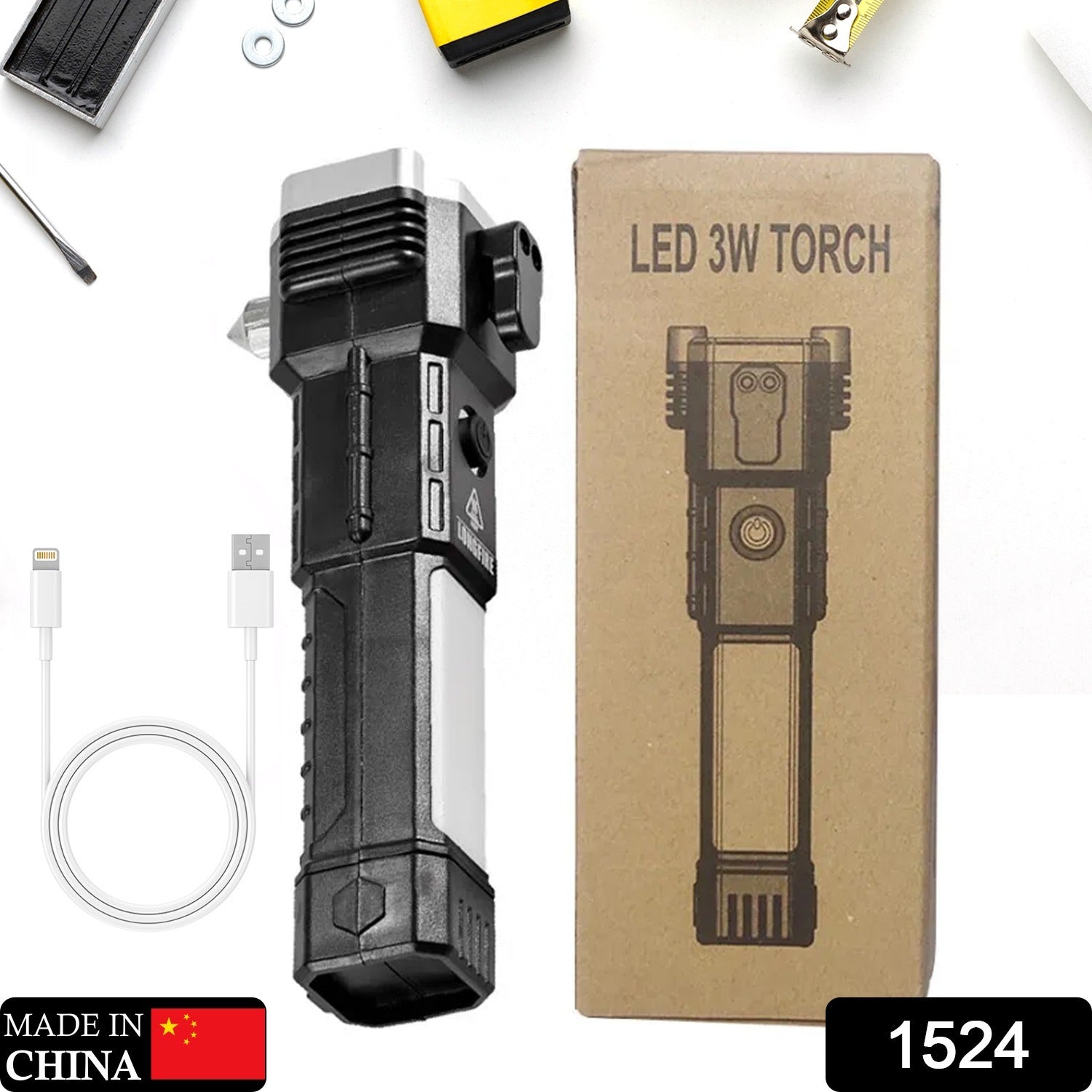 Black and silver multi-tool flashlight next to its brown cardboard box and a white USB charging cable.