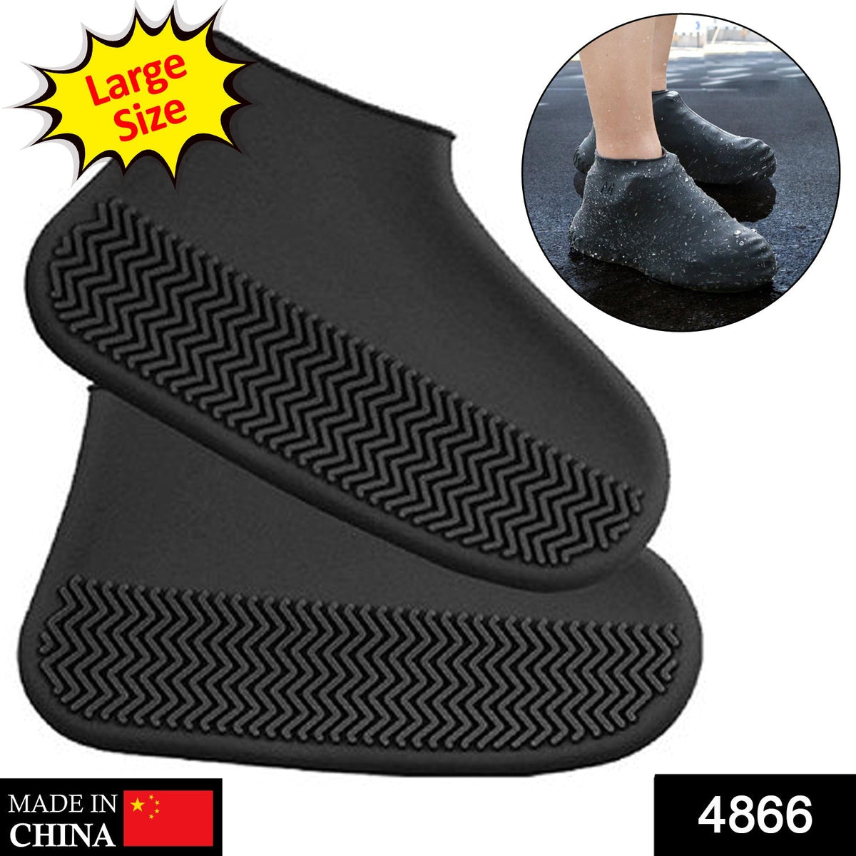 A person's legs and feet, wearing black silicone shoe covers, stand on a wet wooden deck.