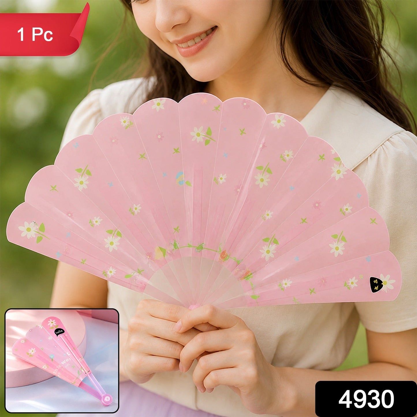 A woman holds a pink fan with white floral patterns, with a red