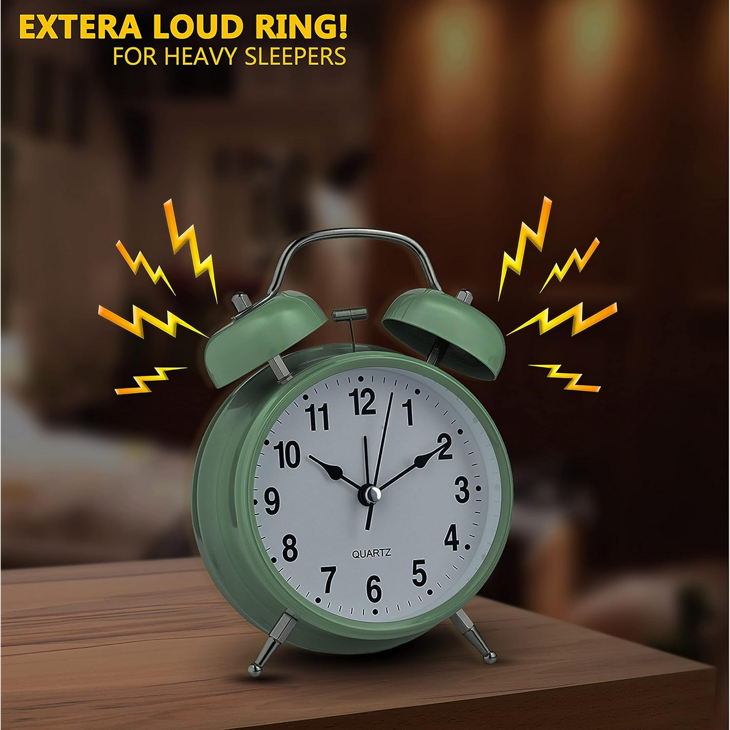 Hand holding the compact twin-bell analog alarm clock for scale.