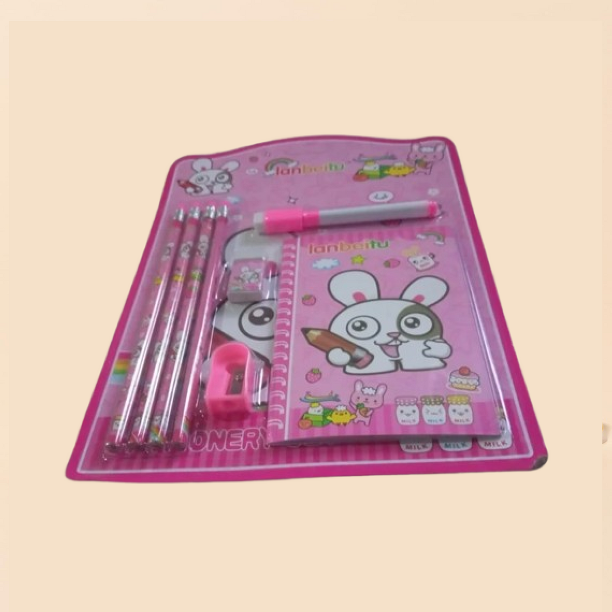 A pink bunny-themed stationery set in clear packaging, including pencils, a notebook, an eraser, a sharpener, and a marker.