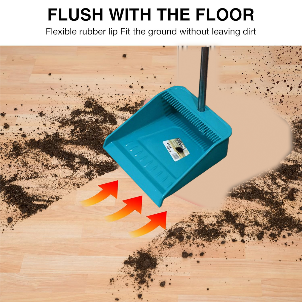 A teal dustpan with a flexible rubber lip is on a wood floor, sweeping dirt into it with orange arrows.