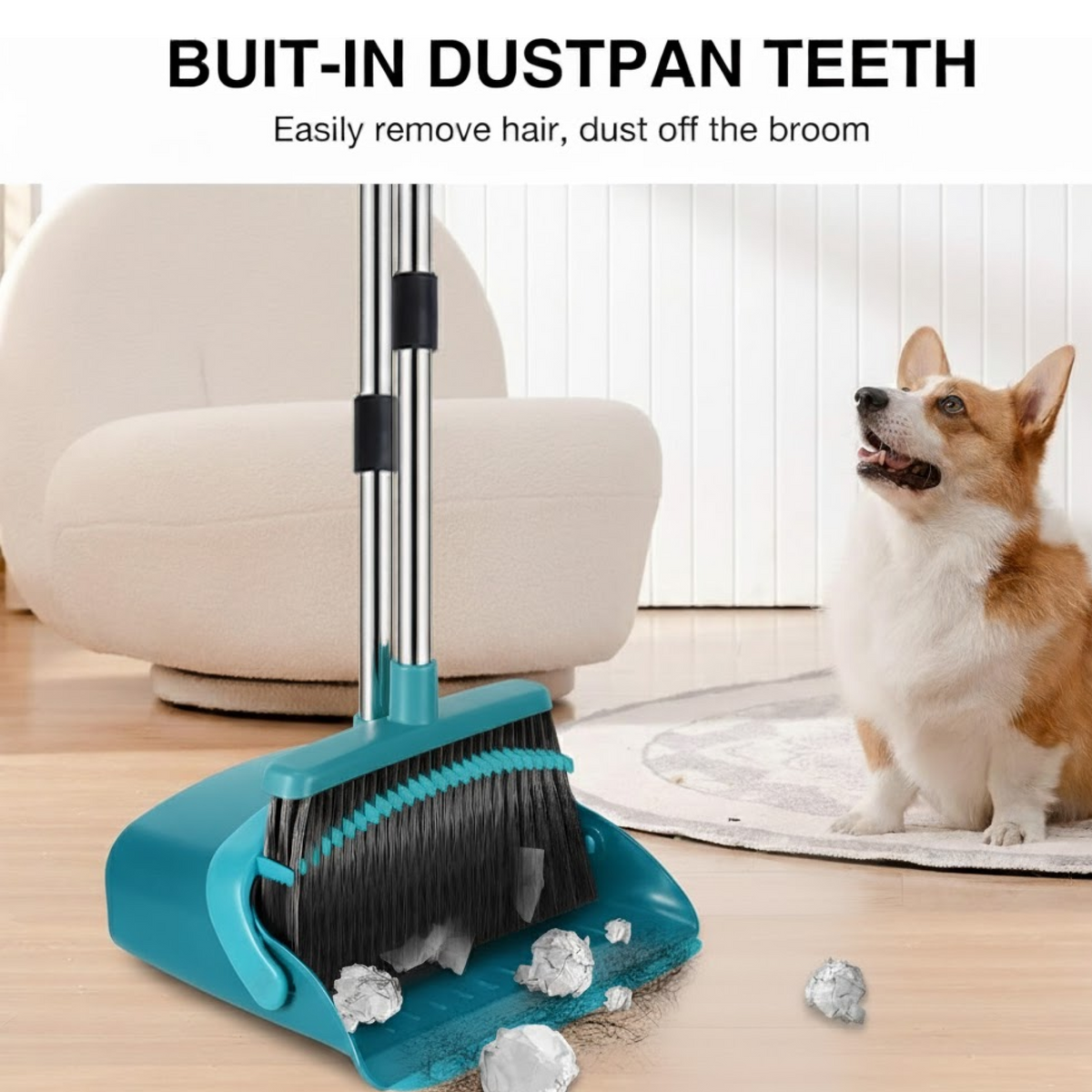 A teal dustpan with built-in teeth for cleaning the broom, with a corgi dog looking on in the background.