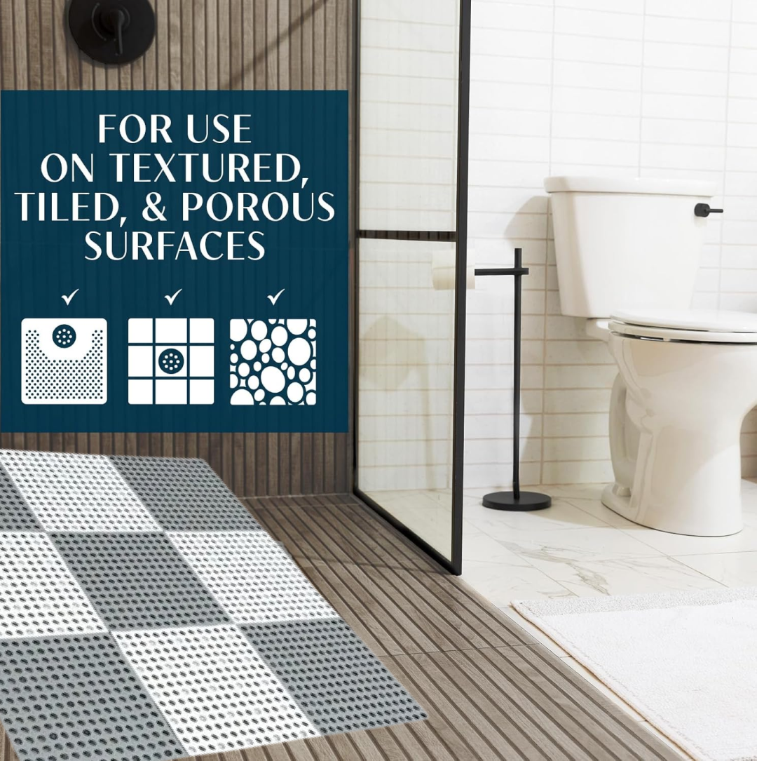 A bathroom scene with a toilet and shower, featuring text about the mat's suitability for various surfaces.