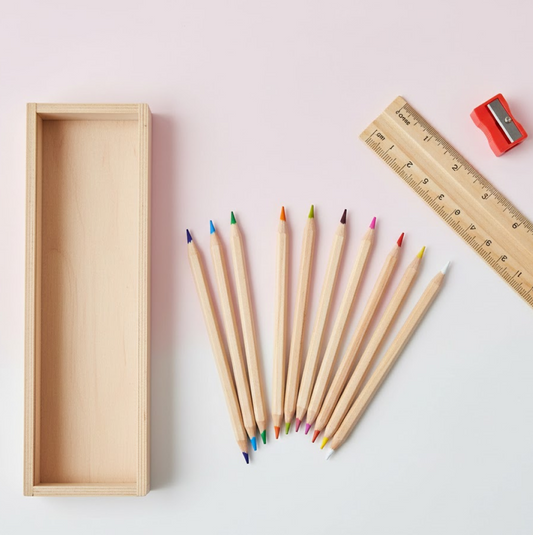 A complete 12-piece wooden pencil set with vibrant colors, a box, ruler, and sharpener.