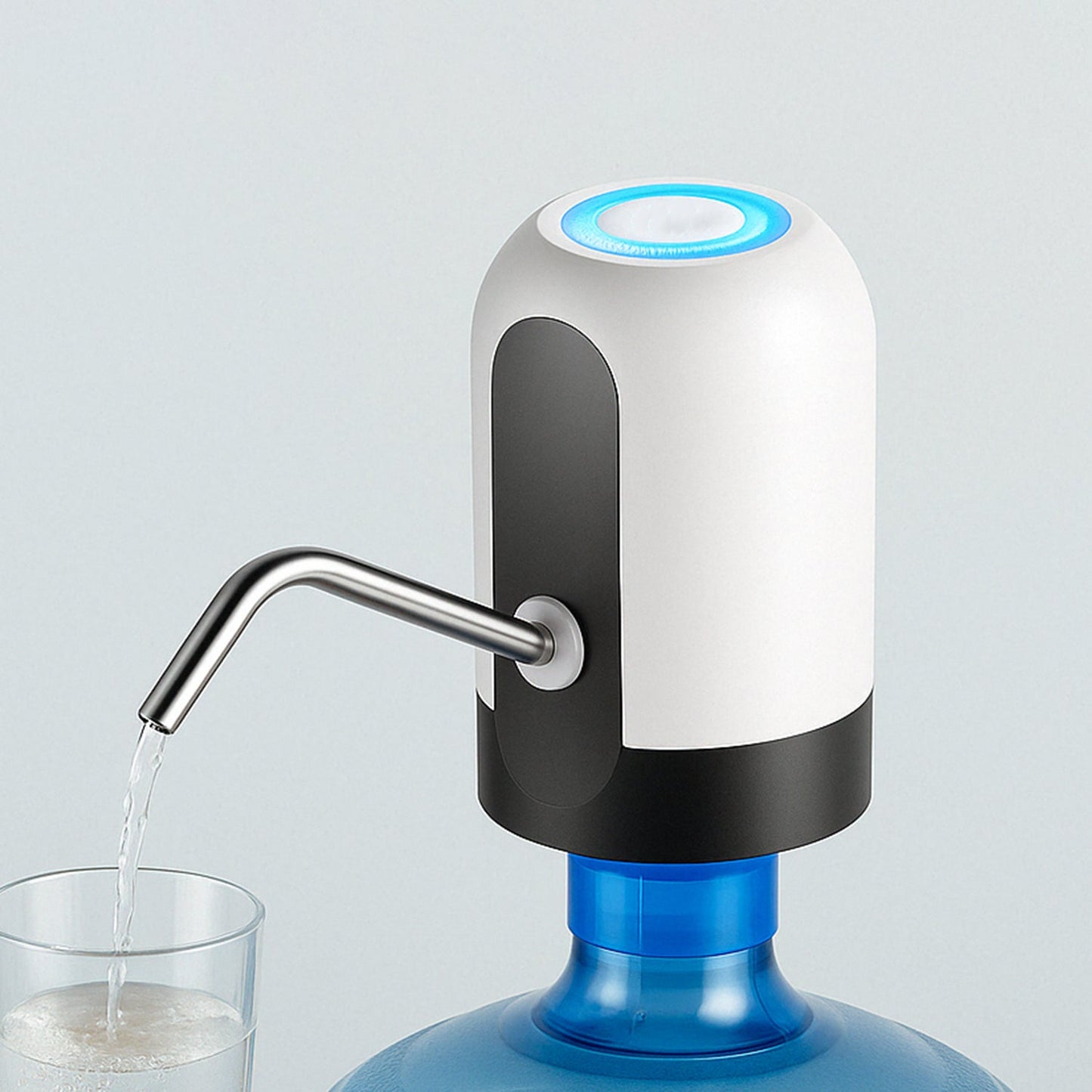 White and black automatic water pump with a blue light on top, dispensing water into a glass from a large blue water bottle.
