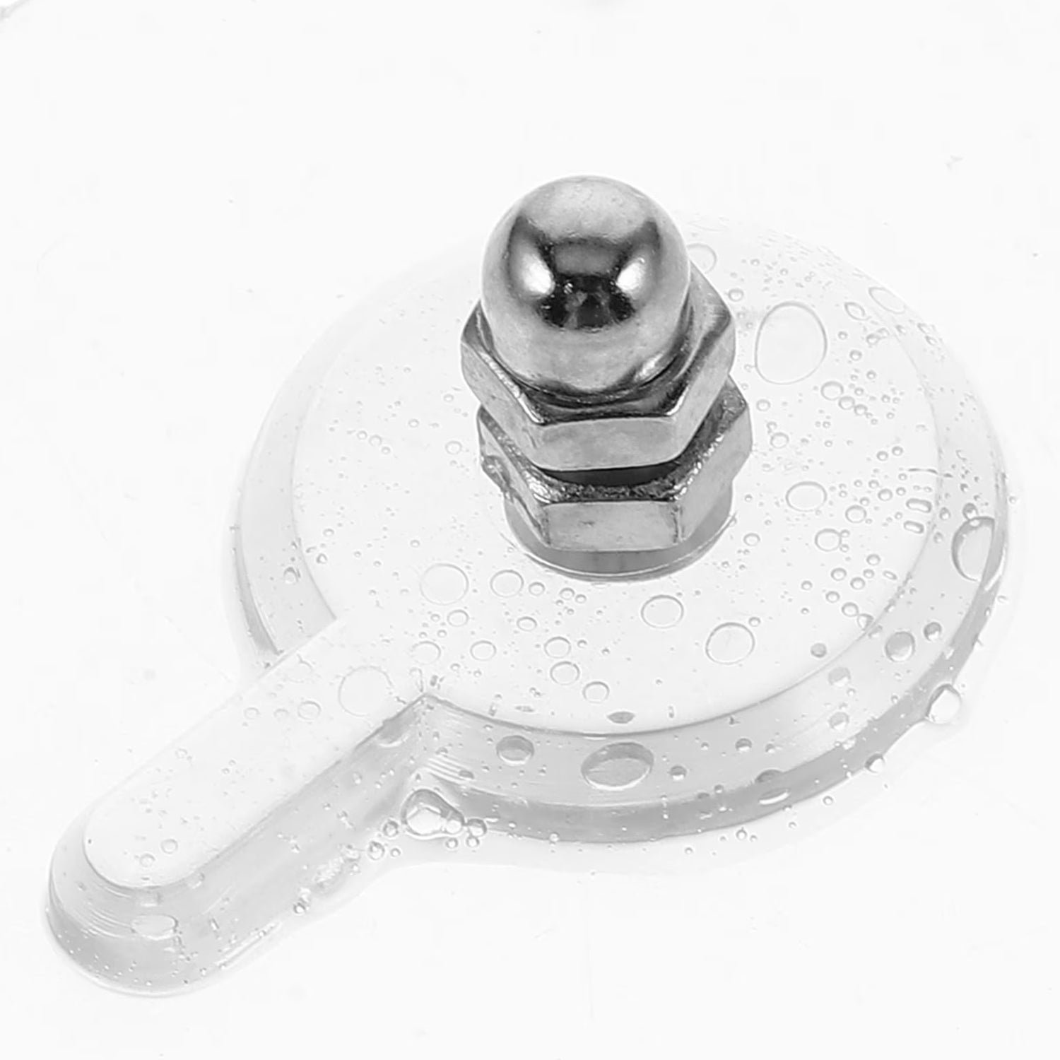 A close-up of a clear self-adhesive wall hook with a silver knob shows water droplets on its surface.