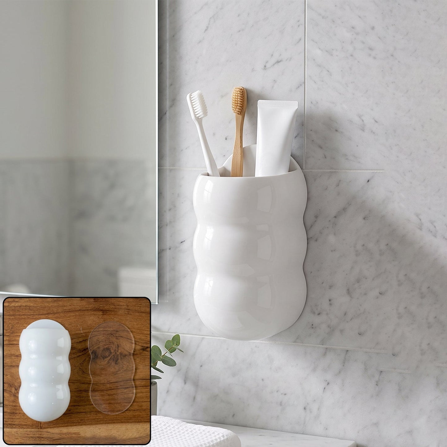 White, caterpillar-shaped wall holder with toothbrushes and toothpaste, next to a mirror and sink.