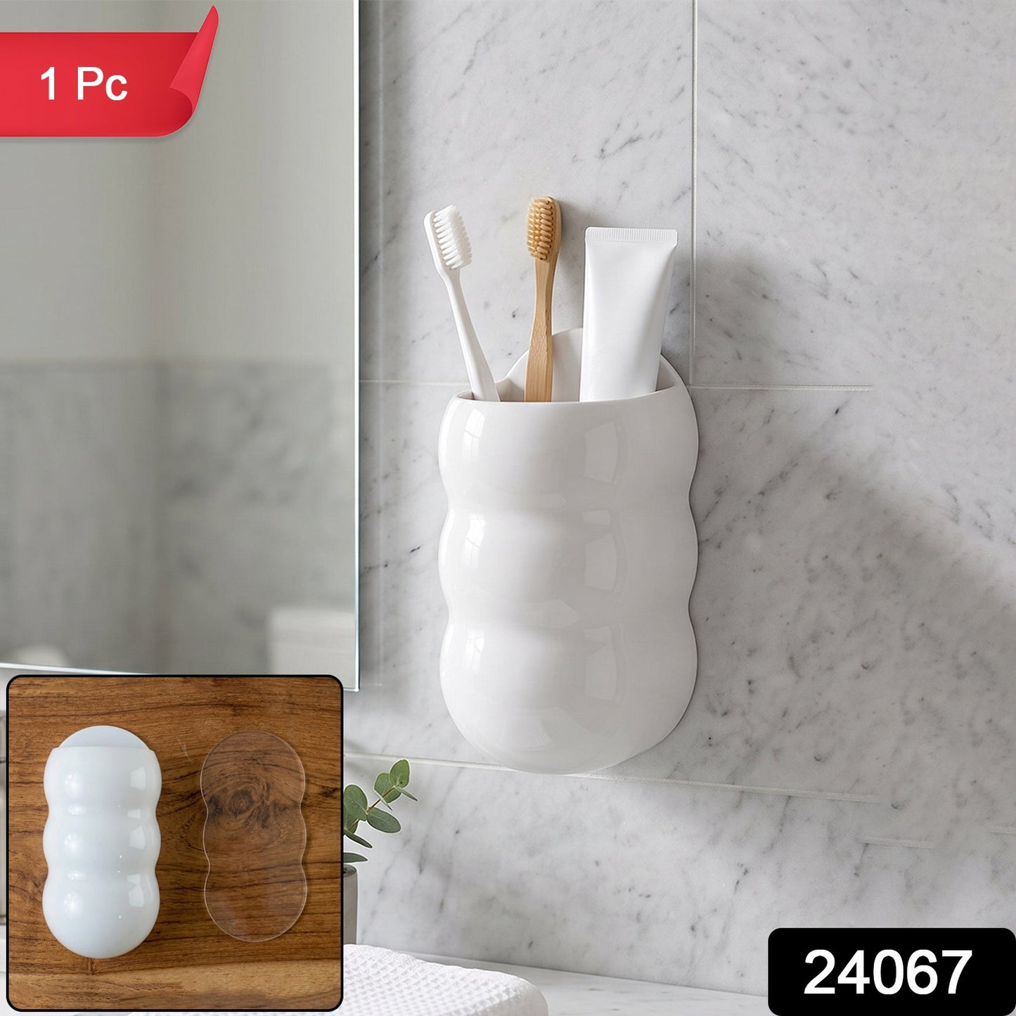 White, caterpillar-shaped wall holder with toothbrushes and toothpaste, with a red "1 Pc" label and black "24067" label.