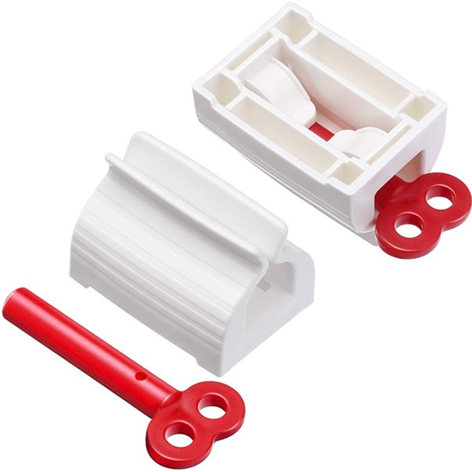 Two white plastic tube squeezers and a detached red winding key are displayed on a white background