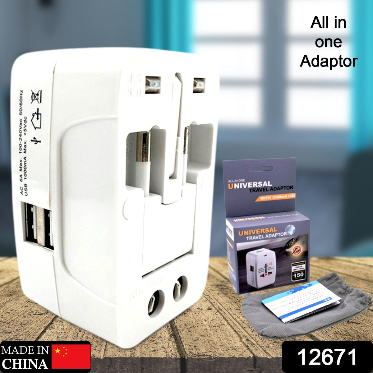 White universal travel adapter with its packaging, a small instruction booklet, and a gray pouch.