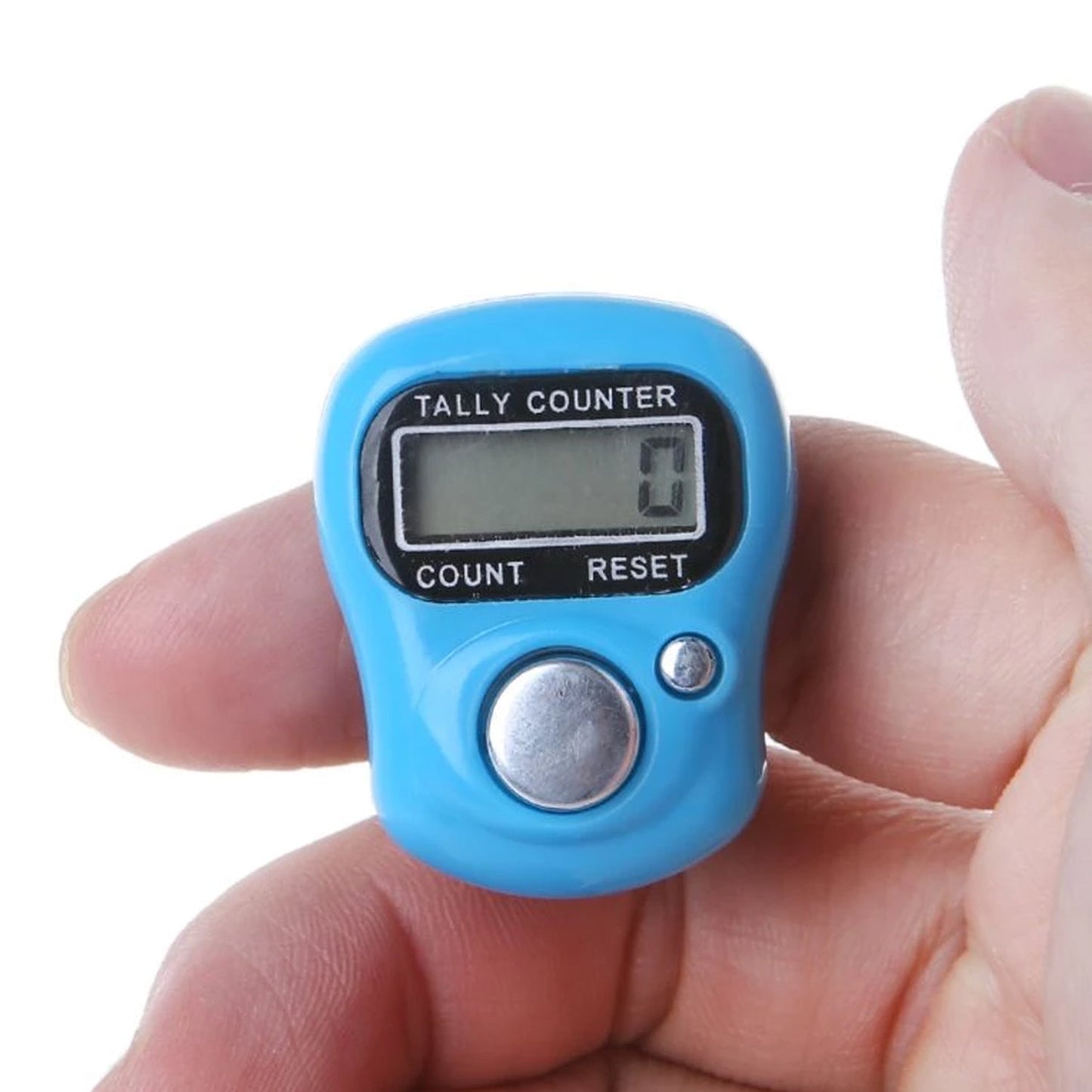A hand holds a blue digital tally counter, showing the display with a count of 0 and silver buttons.