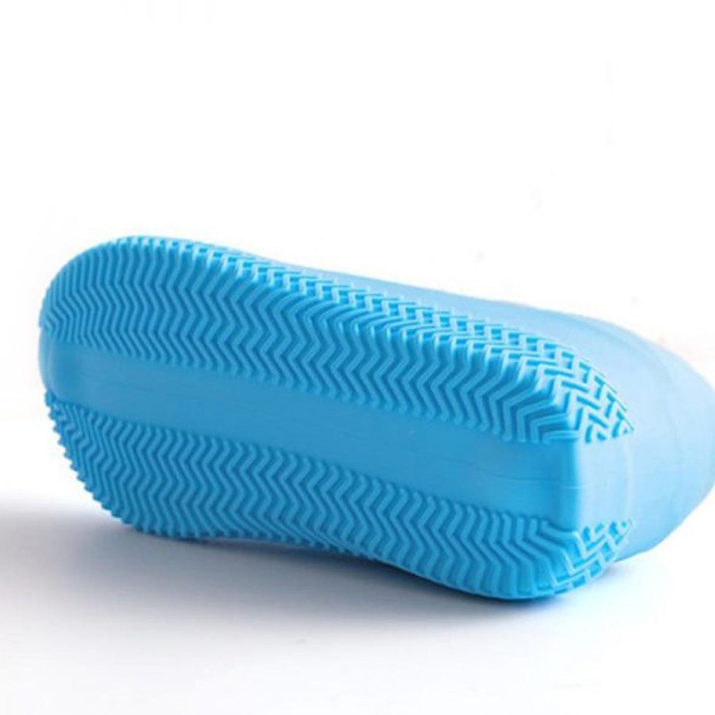 The bottom of a blue silicone shoe cover, showing its textured, non-slip sole pattern.